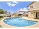 Inviting pool surrounded by lounge chairs, perfect for relaxation and entertainment in the backyard at 40161 N Westray Way, San Tan Valley, AZ 85140