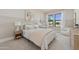Inviting bedroom with a pink accent wall, comfortable bed, and sunlit window at 42046 N Golden Trl, San Tan Valley, AZ 85140