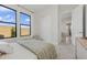 Comfortable bedroom with large windows, closet, and soft carpeting creates a relaxing atmosphere at 42046 N Golden Trl, San Tan Valley, AZ 85140