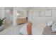 Bright bedroom with a wooden dresser, neutral tones, and artwork at 42046 N Golden Trl, San Tan Valley, AZ 85140
