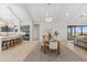 Open floorplan dining area connecting to the kitchen and living room with natural light at 42046 N Golden Trl, San Tan Valley, AZ 85140