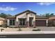 Beautiful single-story home featuring stone accents, a covered entry, and a two-car garage at 42046 N Golden Trl, San Tan Valley, AZ 85140