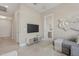Cozy living room featuring neutral walls, a modern TV console, and stylish decor at 42046 N Golden Trl, San Tan Valley, AZ 85140