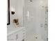 Close-up of a tiled shower enclosure with glass doors, complemented by modern fixtures at 42046 N Golden Trl, San Tan Valley, AZ 85140