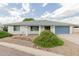 Inviting single-story home featuring desert landscaping and a two-car garage at 4842 W Christine Cir, Glendale, AZ 85308