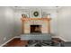 Inviting fireplace with mantel decorated with stylish decor and comfortable seating at 4842 W Christine Cir, Glendale, AZ 85308