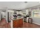 Bright kitchen features stainless steel appliances, plenty of cabinets and counter space with a butcher block island at 4842 W Christine Cir, Glendale, AZ 85308