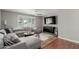 Cozy living room with ample seating, ceiling fan, and bright natural light at 4842 W Christine Cir, Glendale, AZ 85308