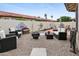 Cozy backyard featuring gravel, mature landscaping, stylish outdoor seating, and a fire pit at 542 S Higley Rd # 52, Mesa, AZ 85206