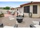 Charming backyard with gravel, desert landscaping, cozy seating and a fire pit at 542 S Higley Rd # 52, Mesa, AZ 85206
