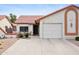 Charming single-story home featuring a tile roof, two-car garage, and desert landscaping at 542 S Higley Rd # 52, Mesa, AZ 85206