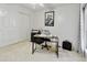 Office boasts a desk, large windows, neutral paint, and ample closet space at 542 S Higley Rd # 52, Mesa, AZ 85206