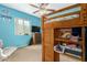 Bedroom featuring a bunk bed and blue walls at 5537 W Boca Raton Rd, Glendale, AZ 85306
