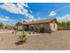 Quaint single-Gathering home boasting beautiful desert landscaping and a welcoming facade at 5537 W Boca Raton Rd, Glendale, AZ 85306