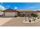 Charming single-story home with a well-maintained yard and a two-car garage at 5537 W Boca Raton Rd, Glendale, AZ 85306