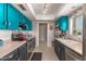 Bright kitchen with tile floor, colorful cabinets, and lots of counter space at 5537 W Boca Raton Rd, Glendale, AZ 85306