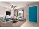 Bright living room with plush seating, ceiling fan, and modern décor at 5537 W Boca Raton Rd, Glendale, AZ 85306