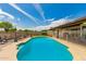 Sparkling swimming pool is fenced in and surrounded by a concrete deck with desert landscaping at 5537 W Boca Raton Rd, Glendale, AZ 85306