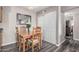Charming dining area with wooden table set and view into other rooms at 5877 N Granite Reef Rd # 2240, Scottsdale, AZ 85250
