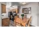 The well-lit kitchen is enhanced with wooden cabinets, granite countertops, and modern appliances, offering both style and functionality at 5877 N Granite Reef Rd # 2240, Scottsdale, AZ 85250