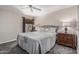 Serene main bedroom featuring a queen-sized bed with a quilted cover, complemented by matching nightstands and lamps at 5877 N Granite Reef Rd # 2240, Scottsdale, AZ 85250