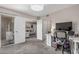 The office space is designed with modern lighting, a desk, and a sliding glass door, providing both comfort and functionality at 5877 N Granite Reef Rd # 2240, Scottsdale, AZ 85250