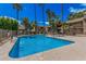 Dive into the sparkling community pool surrounded by palm trees and inviting landscaping at 5877 N Granite Reef Rd # 2240, Scottsdale, AZ 85250
