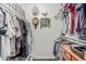 The well-organized walk-in closet features ample hanging space and shelving, perfect for wardrobe storage at 5877 N Granite Reef Rd # 2240, Scottsdale, AZ 85250