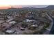 Aerial perspective of homes in a tranquil desert setting at 612 N Signal Butte Rd, Mesa, AZ 85207