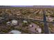 Wide aerial capturing the layout of desert homes with stunning mountain scenery at 612 N Signal Butte Rd, Mesa, AZ 85207
