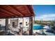 Backyard views of the pool and the house from the patio including an outdoor cooking area at 612 N Signal Butte Rd, Mesa, AZ 85207