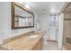 This full bathroom features a granite counter top, tile floors and a shower at 612 N Signal Butte Rd, Mesa, AZ 85207