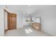 This bedroom offers tile floors, a wood door, a dresser, and large windows at 612 N Signal Butte Rd, Mesa, AZ 85207