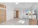 This bedroom offers tile floors, a wood door, a closet, and large windows at 612 N Signal Butte Rd, Mesa, AZ 85207