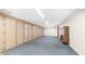 Vast bonus room with wall-to-wall storage cabinets, perfect for organization and versatile use at 612 N Signal Butte Rd, Mesa, AZ 85207