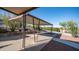 A covered carport with desert landscaping provides parking and curb appeal at 612 N Signal Butte Rd, Mesa, AZ 85207
