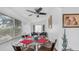 Sunlit dining space with a glass table, comfortable seating, and bright decor at 612 N Signal Butte Rd, Mesa, AZ 85207