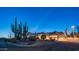 Exterior features include desert landscaping, Southwestern architecture, and a covered drive at 612 N Signal Butte Rd, Mesa, AZ 85207