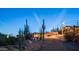 The exterior features desert landscaping, Southwestern architecture, and a covered drive at 612 N Signal Butte Rd, Mesa, AZ 85207