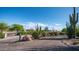 Desert landscaping featuring various cacti and native plants, enhancing curb appeal and natural beauty at 612 N Signal Butte Rd, Mesa, AZ 85207