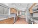 Updated kitchen with stainless appliances, granite counters, and ample natural light at 612 N Signal Butte Rd, Mesa, AZ 85207