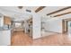 Kitchen and living room featuring tiled floors, modern appliances, and breakfast bar at 612 N Signal Butte Rd, Mesa, AZ 85207