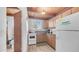 Bright kitchen with wooden cabinets, a window, and appliances, offering a practical cooking space at 612 N Signal Butte Rd, Mesa, AZ 85207