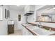 Cozy kitchen area with double sink, tile flooring, and lots of natural light at 612 N Signal Butte Rd, Mesa, AZ 85207