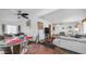 Open-concept living and dining area with hardwood floors and ample natural light at 612 N Signal Butte Rd, Mesa, AZ 85207