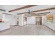 Open concept living room boasting beamed ceilings, Saltillo tile flooring, and seamless flow to other living areas at 612 N Signal Butte Rd, Mesa, AZ 85207