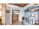 Cozy living room with built-in shelving, closet, and unique decorative elements, perfect for a relaxing atmosphere at 612 N Signal Butte Rd, Mesa, AZ 85207