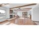 Living room with fireplace, terra-cotta flooring, and natural light at 612 N Signal Butte Rd, Mesa, AZ 85207