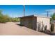 An exterior shot reveals the ample storage space of the outbuilding, perfect for hobbies at 612 N Signal Butte Rd, Mesa, AZ 85207