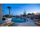 Backyard pool with desert landscaping and lounge chairs at 612 N Signal Butte Rd, Mesa, AZ 85207